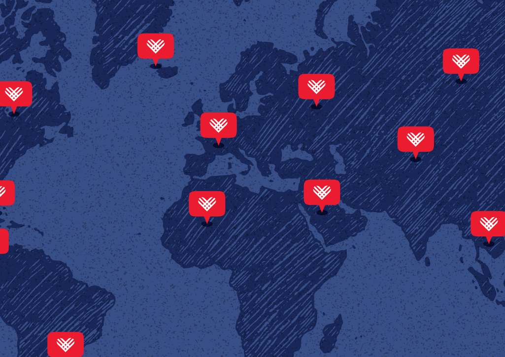 A global map with red GivingTuesday hearts pinned in various countries