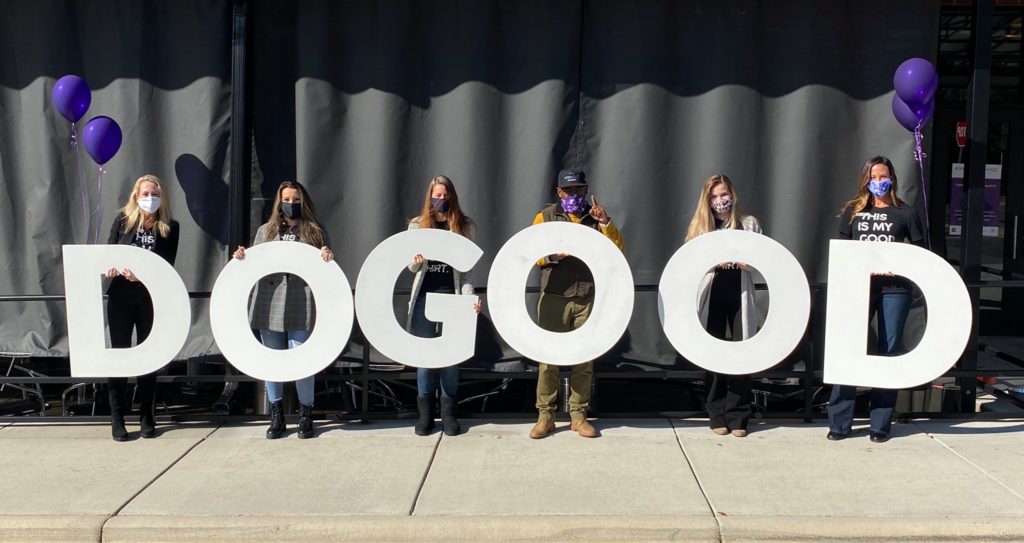 Charlotte leaders holding letters that spell DO GOOD