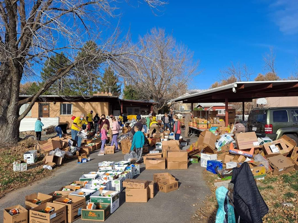 People filling cardboard boxes