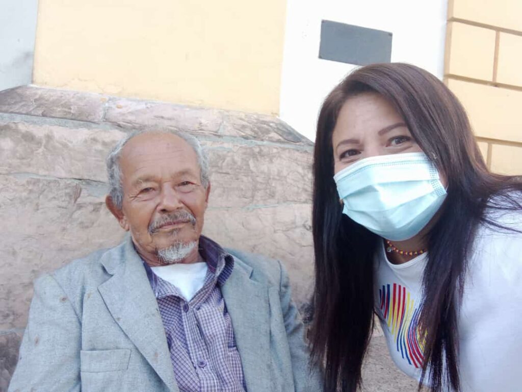 an Old man and a woman with a mask