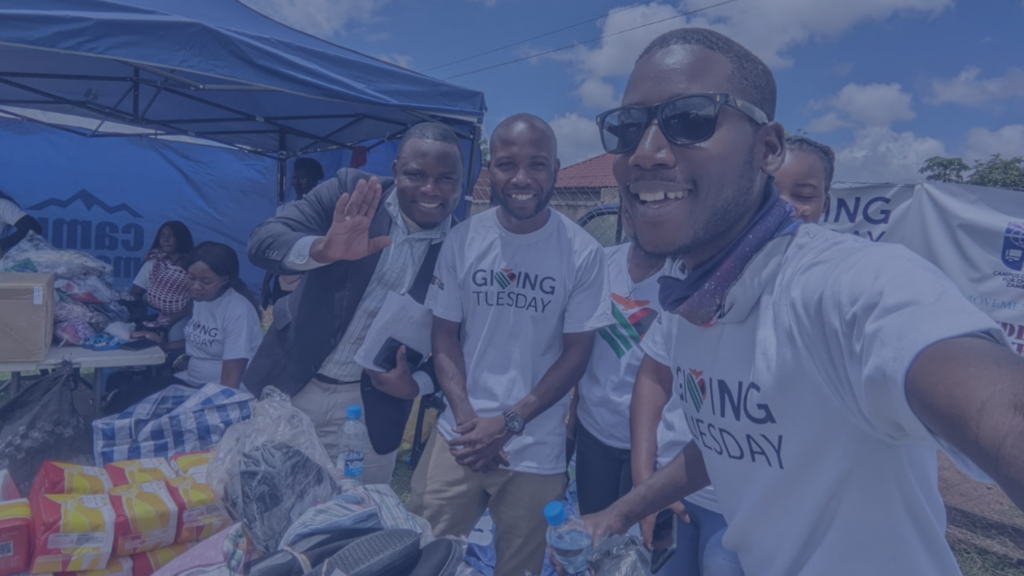 Nigerians collecting food wearing GivingTuesday tshirts