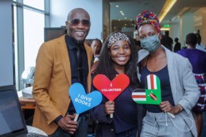 3 people posing with GivingTuesday logos