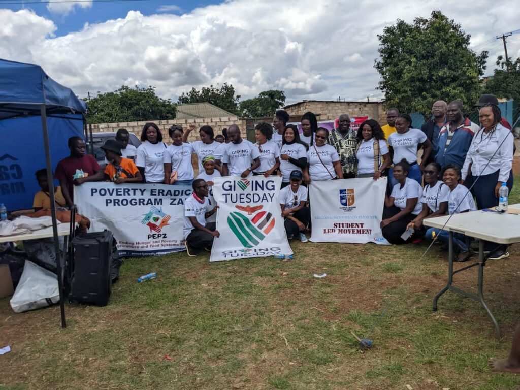 A group of Africans in Zambia at a GivingTueday event where they collected goods for people in need