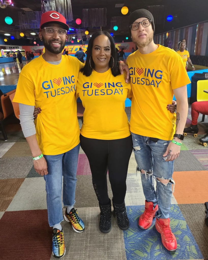 3 people wearing yellow shirts that have the GivingTuesday logo on it!