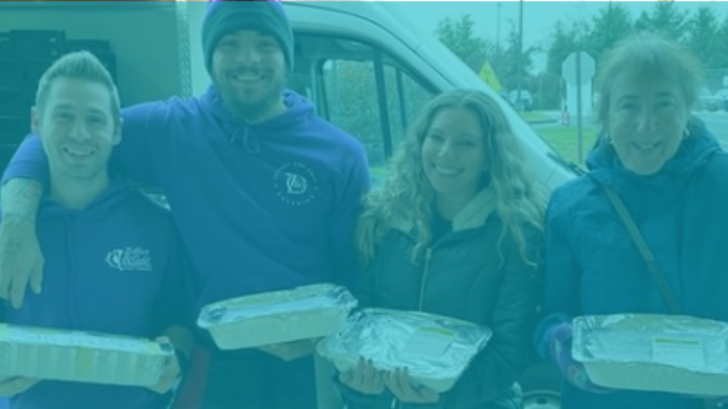 4 smiling people holding casseroles