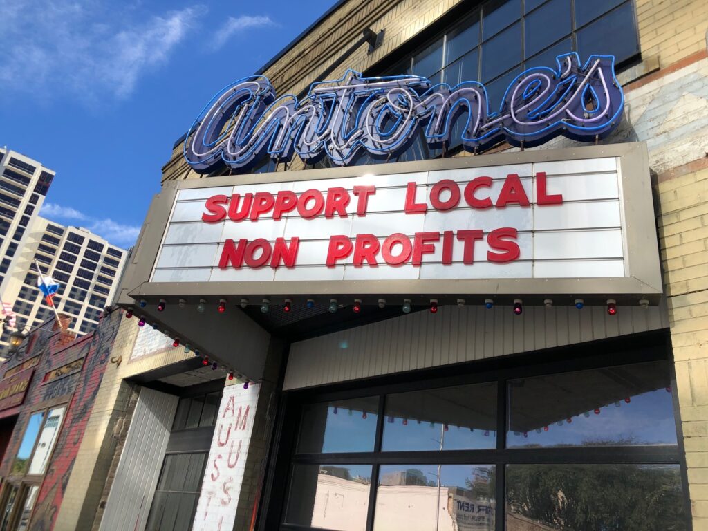 support local nonprofits on a marquee at a theater