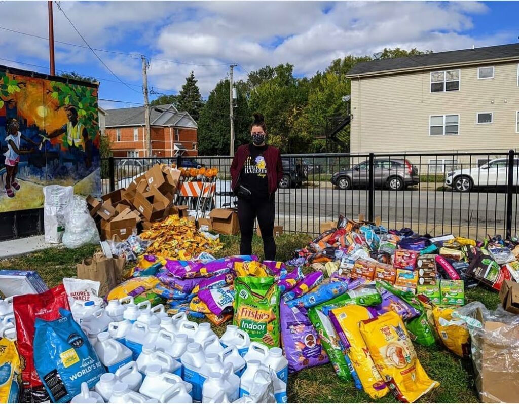 person with lots of animal food surrounding them